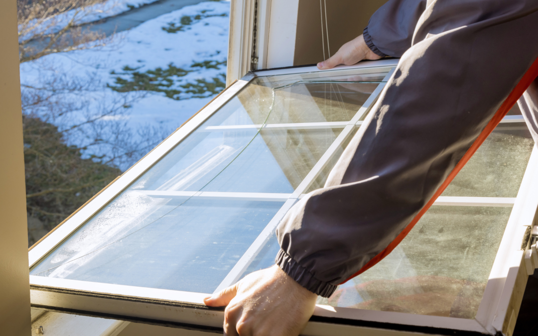 window installer placing new window into place
